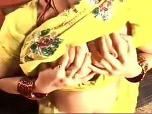 Busty Indian bhabi plays with her tits and slit