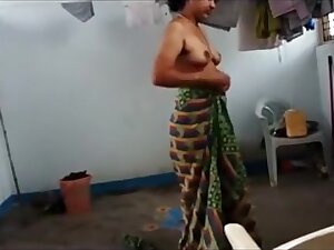 Indian wife with saggy tits puts on her clothes